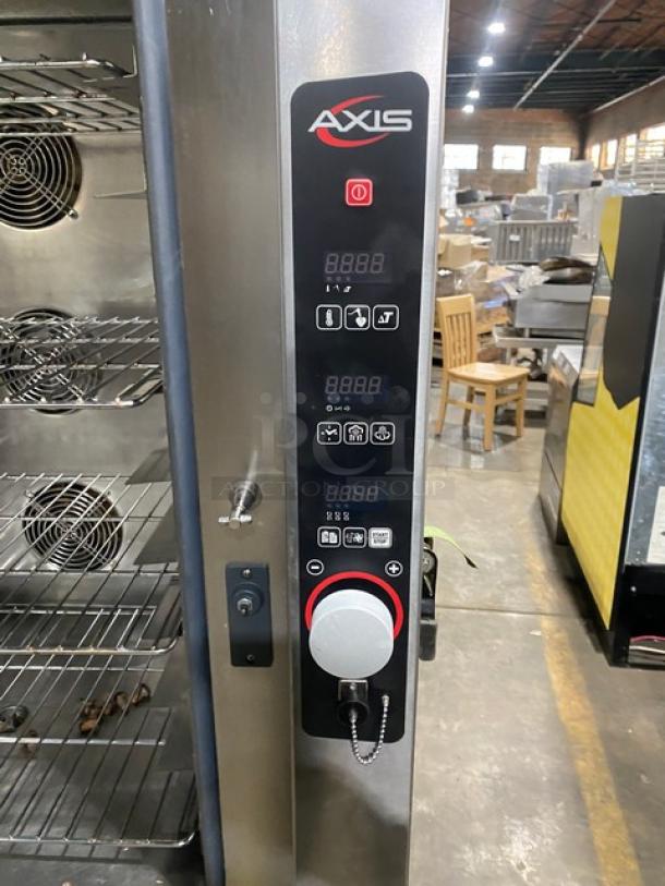 Axis commercial stainless steel combi oven with digital controls, wired oven rack, and legs. Electric powered, 3-phase.
