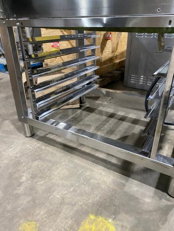 Axis commercial stainless steel combi oven with digital controls, wired oven rack, and 3-phase power. Set on sturdy legs.