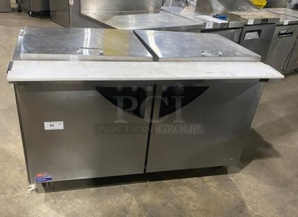 Turbo Air Super Deluxe Series 2-door salad prep table, stainless steel, model TST-60SD-24-N, with cutting board, on casters.