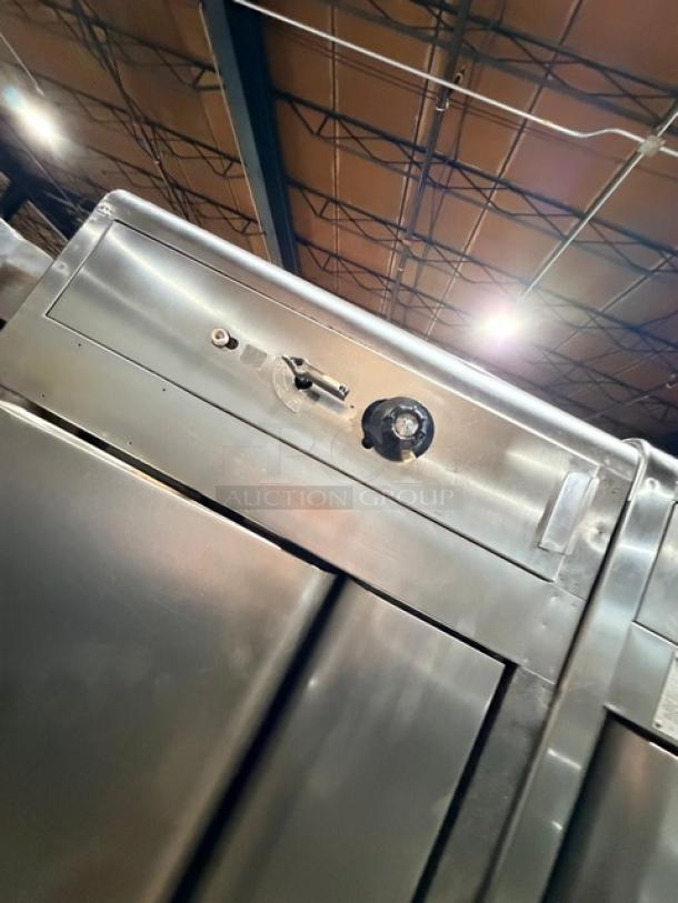 Blodgett model 1060 stainless steel double stacked pizza deck oven, natural gas powered, in good condition, on legs.