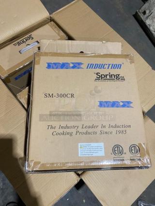 Brand new Spring USA Model SM-300CR induction warmer in box, 120V, commercial grade, labeled with product branding.