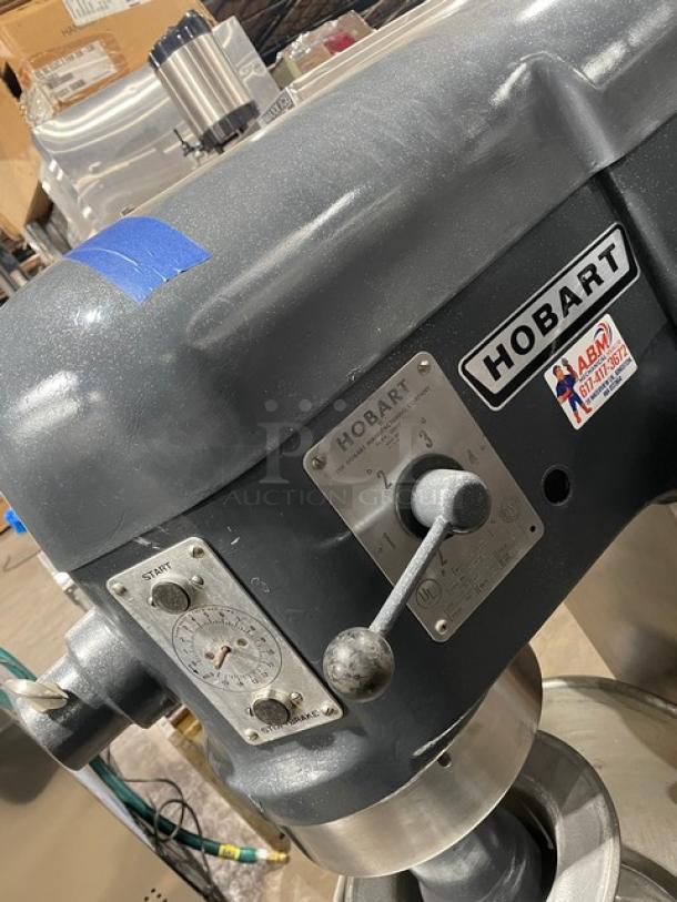 Hobart H-600T commercial 60 qt. dough mixer, charcoal gray, with bowl and hook, 220V 3 phase, model and logo plates visible.