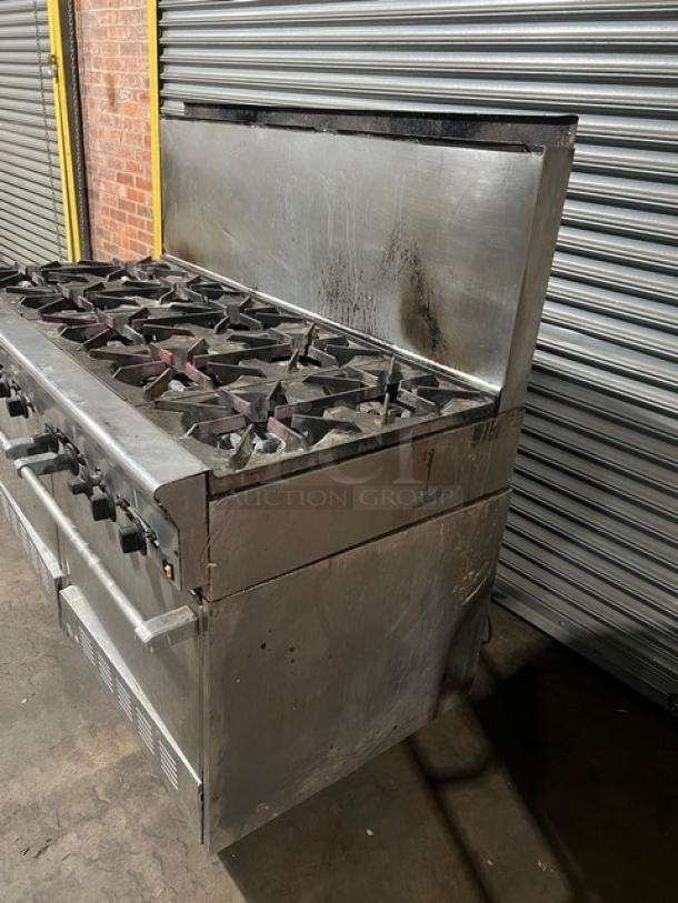 U.S. Range commercial stainless steel gas-powered 10-burner range with double oven, backsplash, and wired oven rack; used condition.