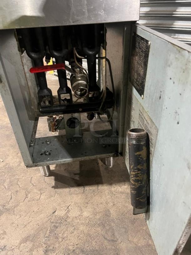 Avantco FF300N stainless steel gas fryer, 2019 model, with left-side and back splash, basket hanger, baskets, on legs.