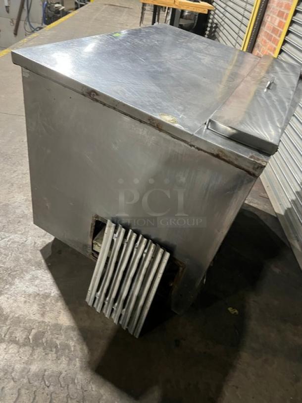 Commercial stainless steel refrigerated salad/sandwich prep table, 1-1/2 door, poly coated wire rack, on casters, visible wear.