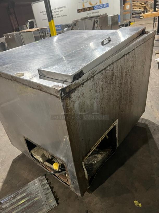 Commercial stainless steel refrigerated salad/sandwich prep table, with 1-1/2 doors, poly coated rack, on casters. Used condition.