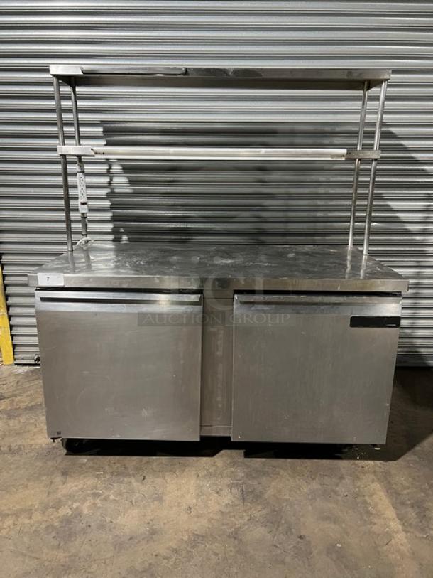 Continental SW60 stainless steel 2-door worktop refrigerator, double overhead shelf, ticket holder, on casters, good condition.