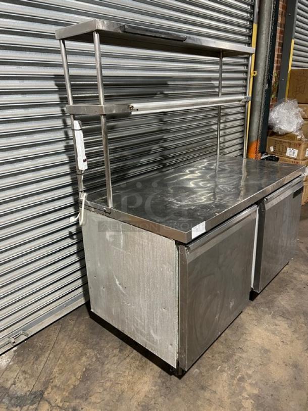 Continental SW60 stainless steel 2-door worktop refrigerator with double overhead shelf, ticket holder, and poly-coated rack.