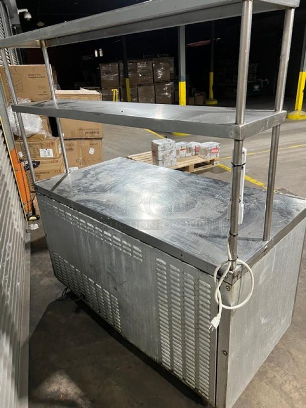 Continental Commercial Stainless Steel 2 Door Worktop Refrigerator, Model SW60, with double overhead shelf, on casters.