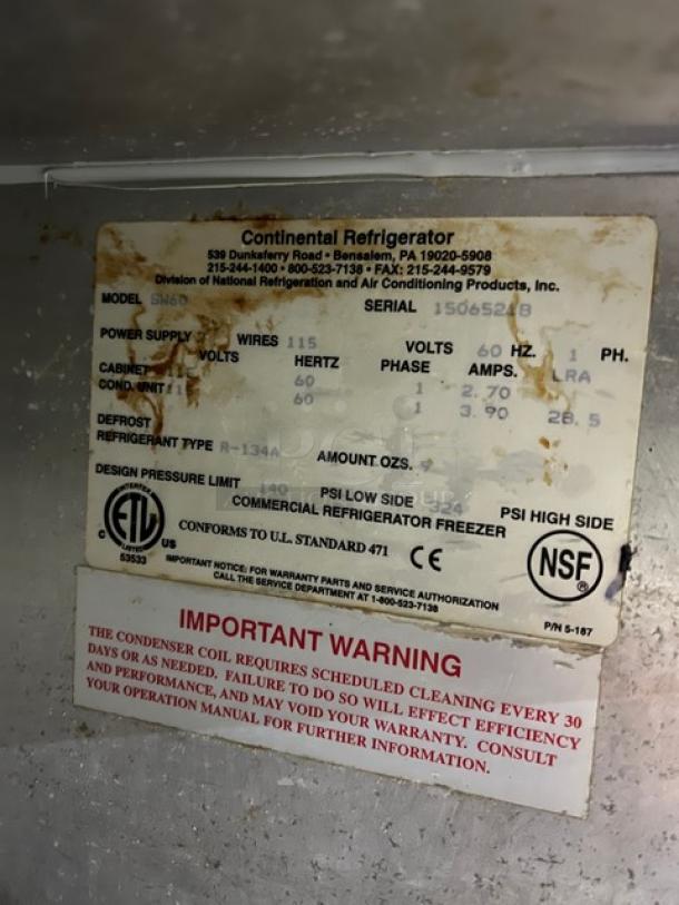 Alt text: "Label on Continental Commercial Stainless Steel 2 Door Worktop Refrigerator, Model SW60, Serial 15065218, 115V, NSF certified."