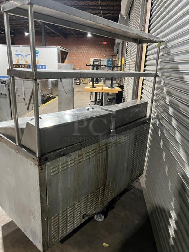 Continental SW60-24M stainless steel 2-door refrigerated prep table with double overhead shelf and poly-coated wire rack.