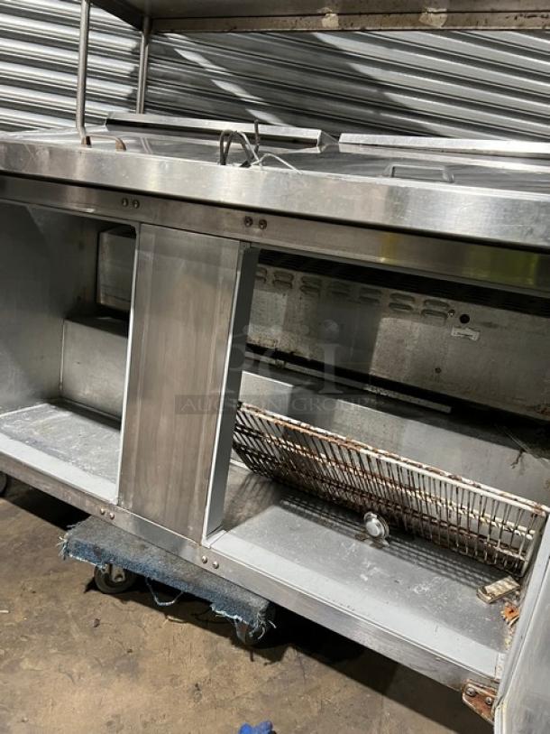 Continental SW60-24M refrigerated prep table, stainless steel, double doors, overhead shelf, poly-coated rack, SN: 15079667.