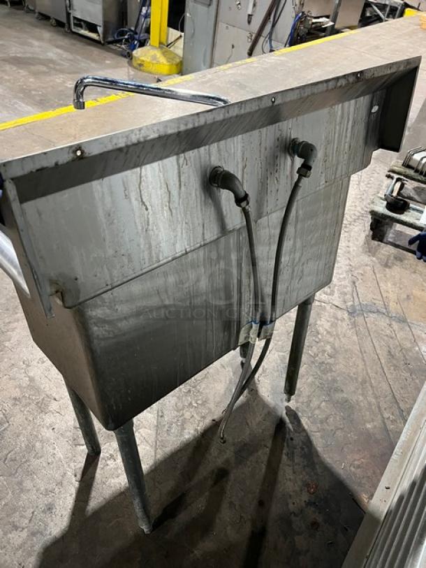 L&J stainless steel 2-compartment prep sink with swing spout swivel faucet, visible wear, mounted on legs.