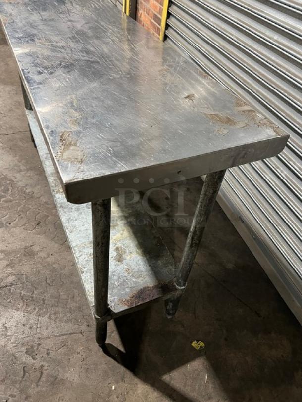 Regency 600T1860G stainless steel worktop table, 18"x60", undershelf, on legs, signs of wear, commercial use.