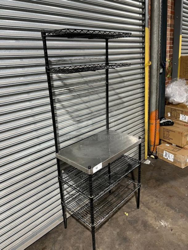 Commercial stainless steel worktop table with double wired racks over and under shelves, on legs. Excellent condition.