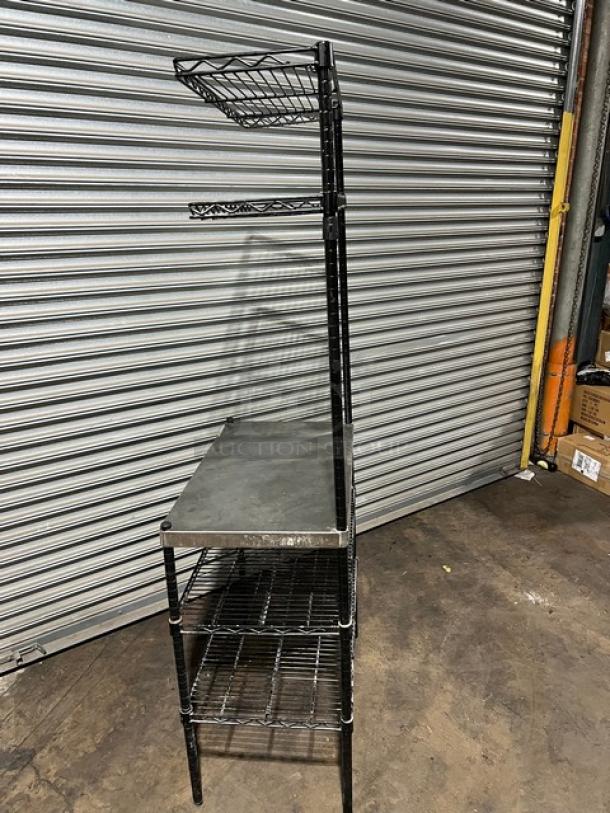 Commercial stainless steel worktop table with double wired rack shelves, upper and lower. Features sturdy legs; excellent condition.