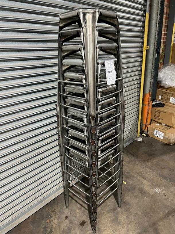 Stack of commercial bar-height stools, metallic finish, stackable design, suitable for bars, sturdy condition, pricing tags visible.