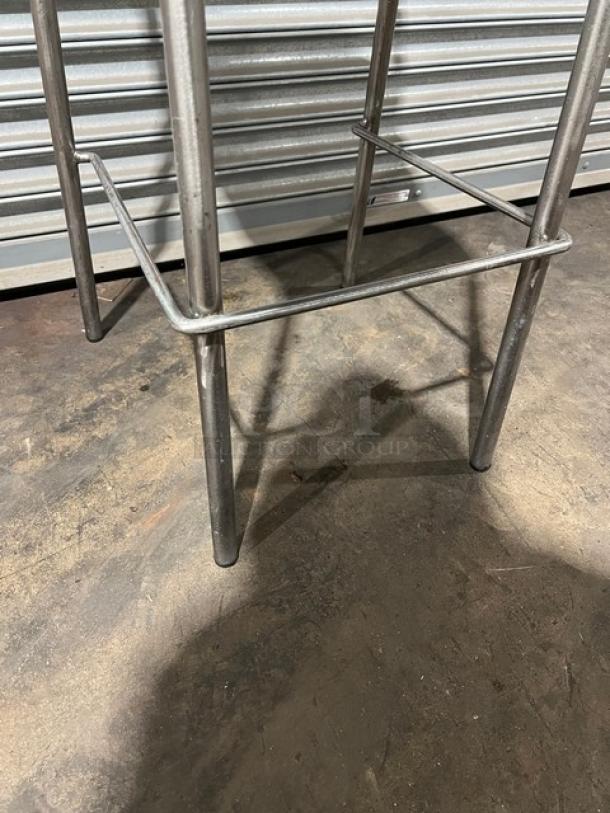 Stackable metal bar-height chair legs, commercial design, durable, pristine condition, ideal for restaurant seating.