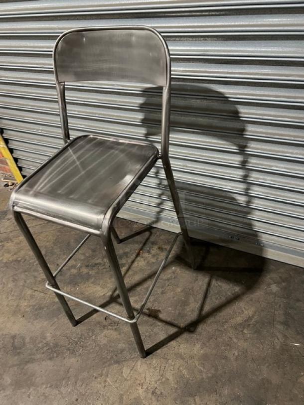 Commercial stackable bar-height chair, metal frame, stackable design, excellent condition, ideal for commercial use.
