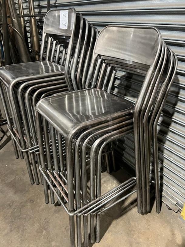 Stackable bar-height chairs, polished metal, commercial use, excellent condition, sold in sets of 7, tagged for auction.
