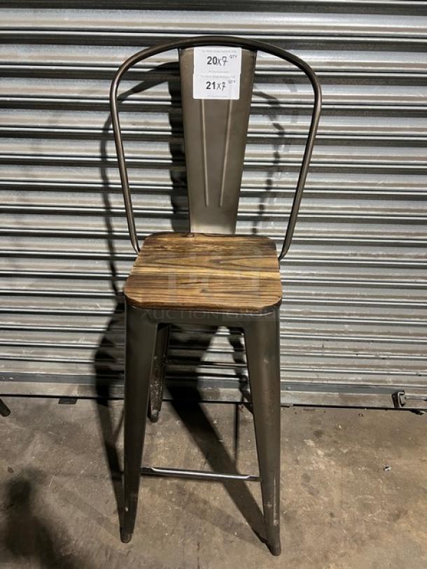 Stackable bar-height chair with metal frame and wooden seat. Features tag indicating pricing details. Suitable for commercial use.
