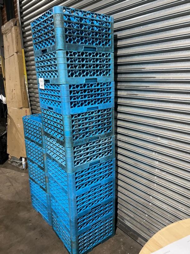 Carlisle blue 25-compartment cup racks with extenders, stacked. Commercial use, durable condition. Includes misc. glasses.