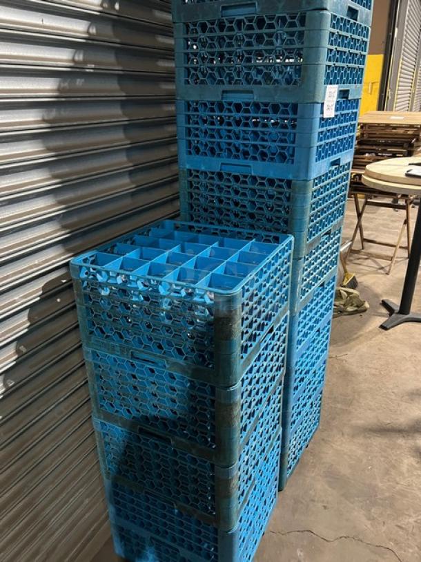 Carlisle commercial blue 25-compartment cup rack with extenders, stacked, good condition. Includes miscellaneous glasses.