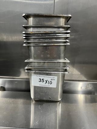 Stack of commercial stainless steel hotel pans, gently used, featuring a label "35 X 10" indicating quantity.