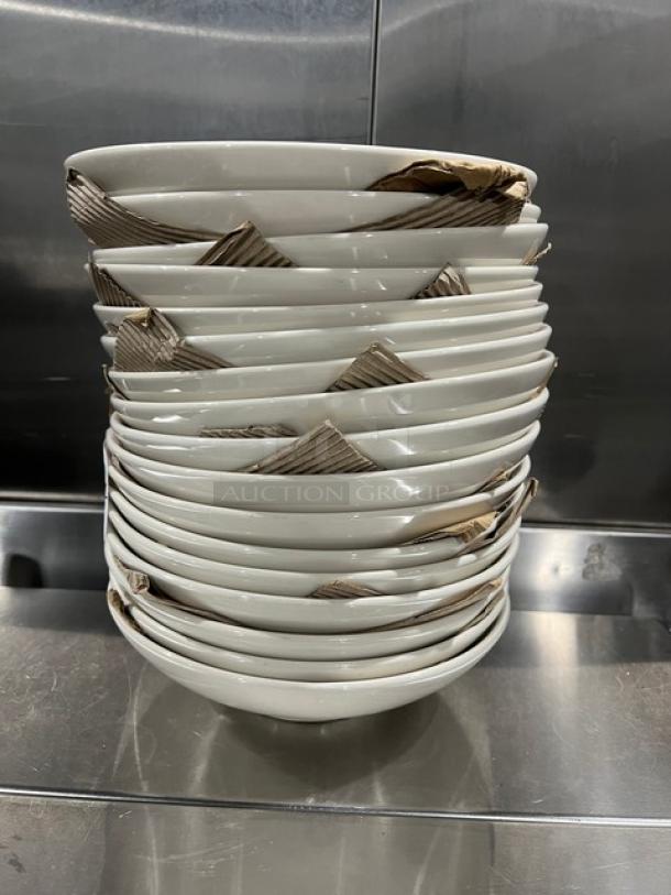 Stack of Anfora Commercial White Round Bowls, neatly packaged with cardboard separators, pristine condition.
