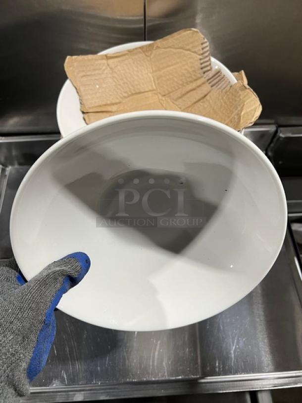 Anfora commercial white round bowl, pristine condition, glossy finish, shown handled with glove. Packaging visible in the background.