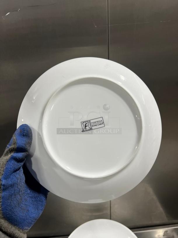 White Fortessa commercial round plate, fine china, new condition. Marked with Fortessa logo and "Fine China."