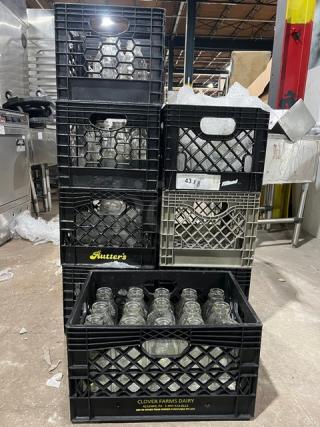 Eight crates of commercial water/juice bottles, labeled "Clover Farms Dairy" and "Rutters." Excellent condition, ready for use.