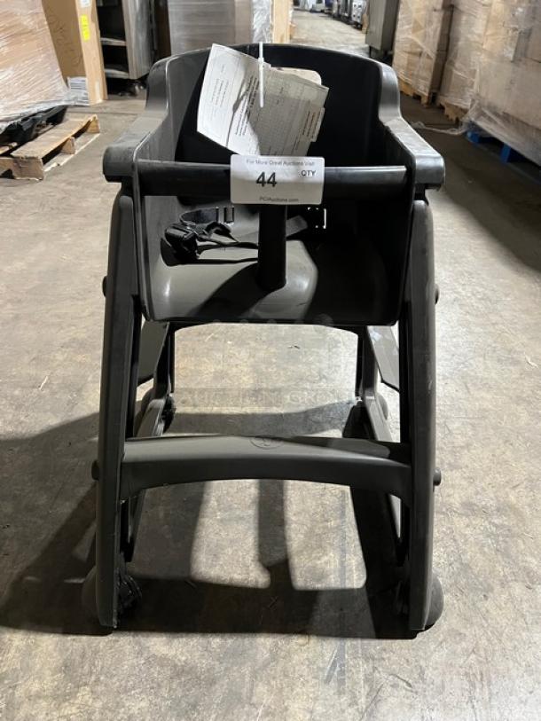 Rubbermaid Commercial Black Restaurant Highchair, Model FG780608BLA, with casters, black plastic, includes safety strap.