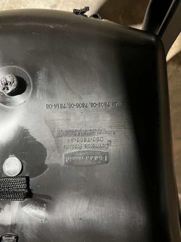 Rubbermaid Commercial black highchair, model FG780608BLA. Features caster wheels. Label displays model and SKU details.