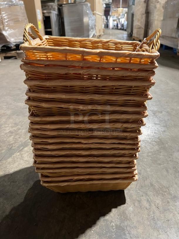 Stack of woven display baskets, natural finish, with sturdy handles. Set of 17; unused condition. Ideal for retail displays.