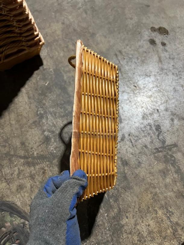 Woven display basket, rectangular, natural fibers, hand-held, excellent condition, stack of similar baskets visible.