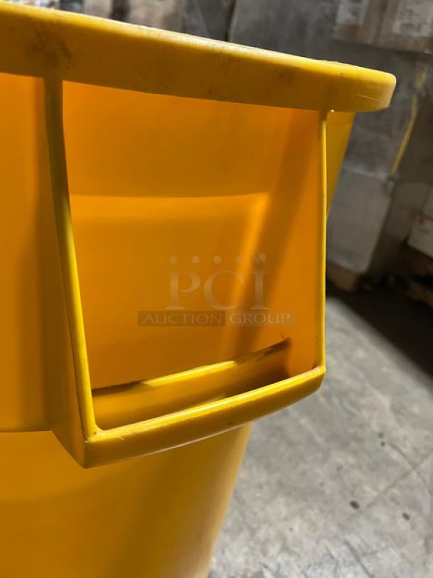 Rubbermaid Brute 55 Gal. yellow trash can; commercial grade; durable plastic; slight wear; sturdy handle.