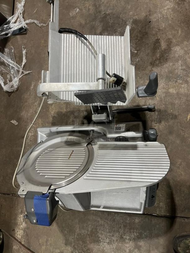 Hobart commercial electric deli meat slicer, countertop model, heavy-duty, metallic finish, power cord attached.