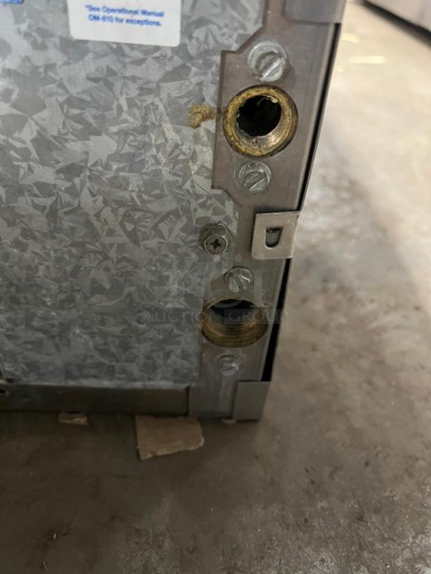 Ice-O-Matic Elevation Series commercial ice machine head, model ICE1006HA2, showing manufacturer label and connector ports.