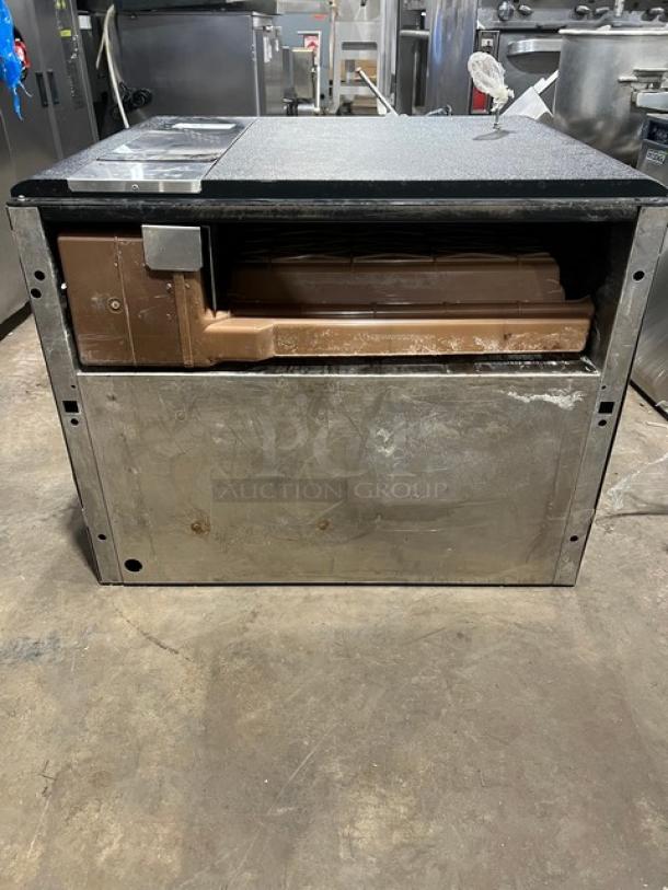 Ice-O-Matic Elevation Series ICE1006HA2 air-cooled ice machine head in used condition with visible wear and metal casing. Serial number: 04111280012056.