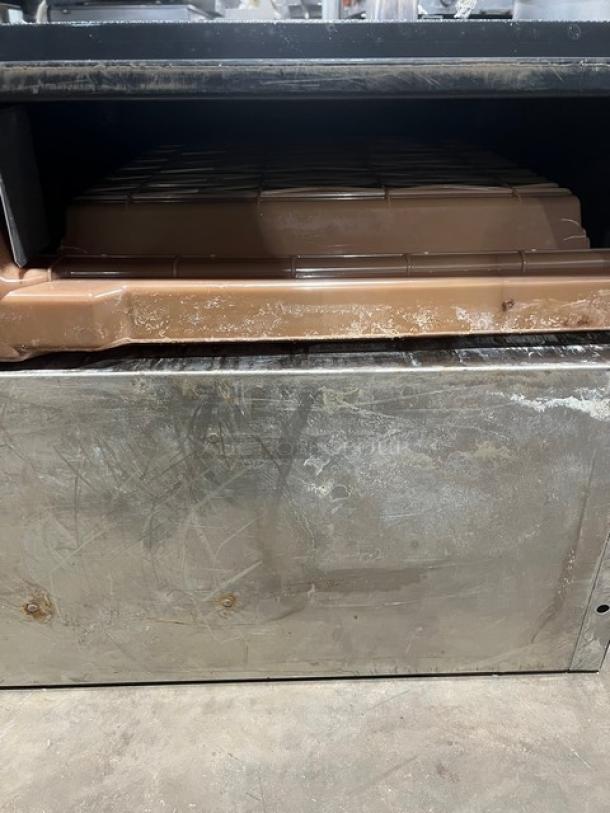 Ice-O-Matic Elevation Series ICE1006HA2 air-cooled ice machine head. Commercial grade, visible wear on metal surface. SN: 04111280012056.