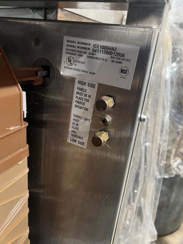 Ice-O-Matic Elevation Series ICE1006HA2 commercial ice machine, air-cooled, model and serial labels visible.