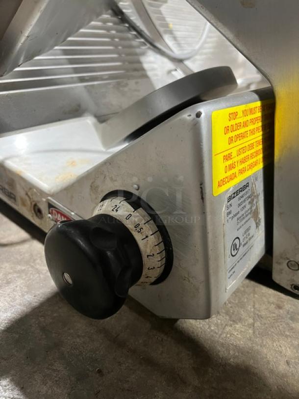 Bizerba stainless steel electric deli meat slicer, SN: 10401317. Features adjustable thickness dial, UL certified, 120V, 1 phase.