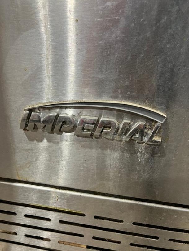 Imperial stainless steel natural gas double-stacked convection oven, wired rack, on casters, brand name visible.