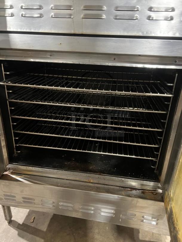 Blodgett commercial stainless steel double-stacked convection oven, natural gas, wired rack, on legs, used condition.