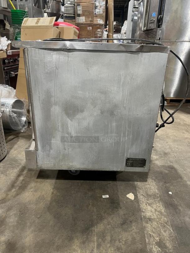 Mainstreet Equipment FGC100 stainless steel convection oven, natural gas, single stack, with wired oven rack and casters.