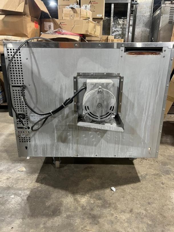 Mainstreet Equipment stainless steel convection oven, model FGC100; natural gas powered, with wired rack; on casters.