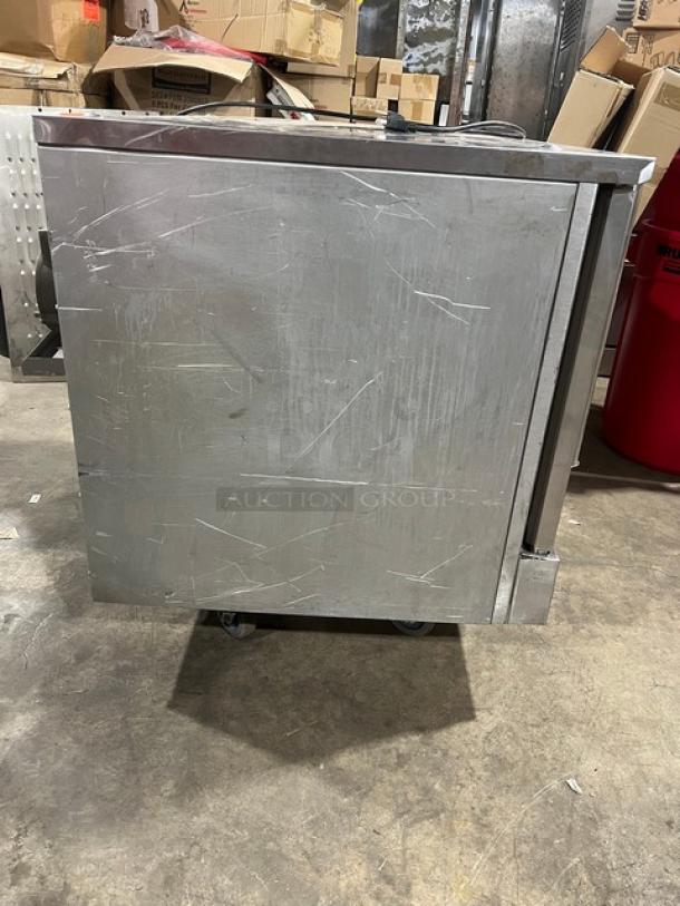 Mainstreet Equipment FGC100 convection oven in stainless steel, gas-powered, single stack, with wired rack, on casters.