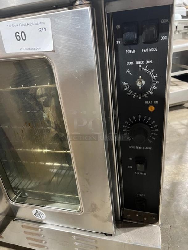 Mainstreet Equipment FGC100 stainless steel convection oven, natural gas, single stack, with wired oven rack, on casters.