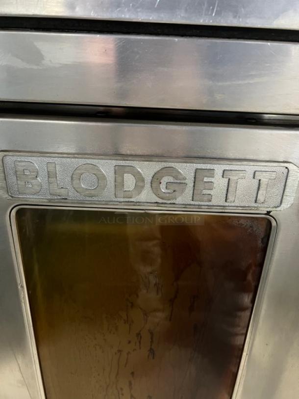 Blodgett commercial stainless steel natural gas convection oven, double stacked, wired oven rack, on legs, Blodgett label visible.